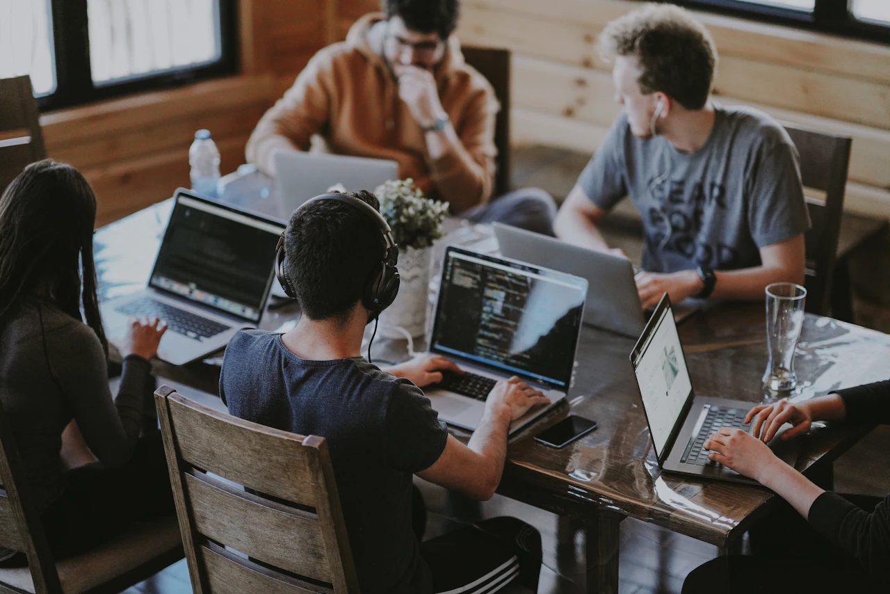 Entreflux team collaborating around a table